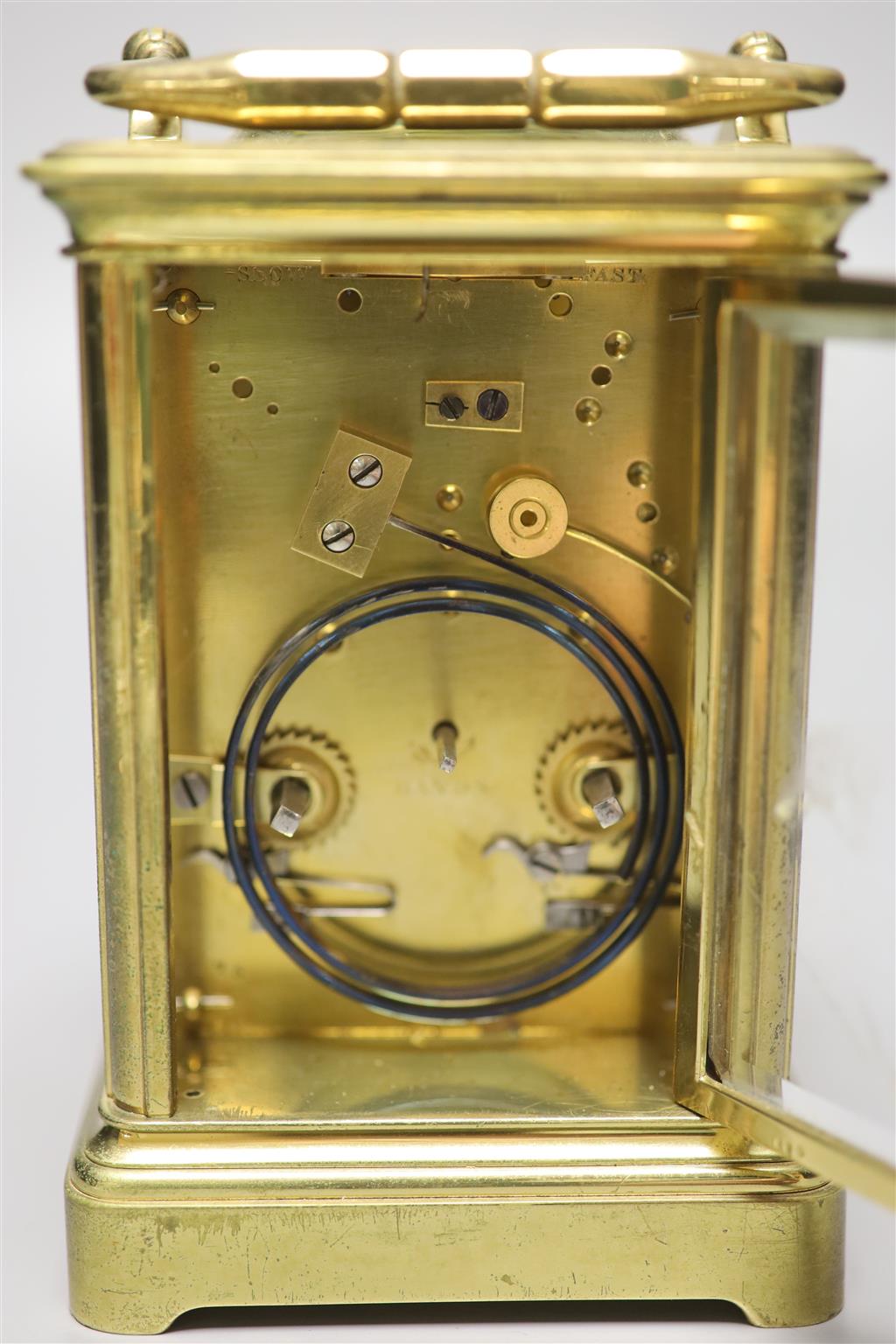 A brass carriage clock by Howell James & Co, height with handle down 13.5cm